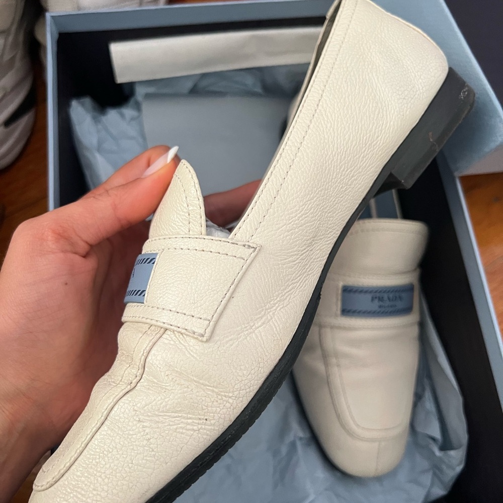 White Prada flats